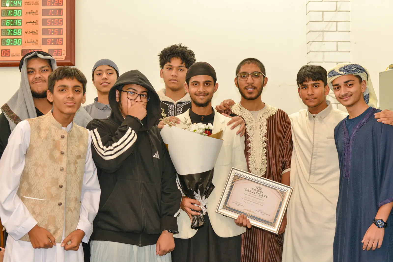 Graduates celebrating together with their certificates